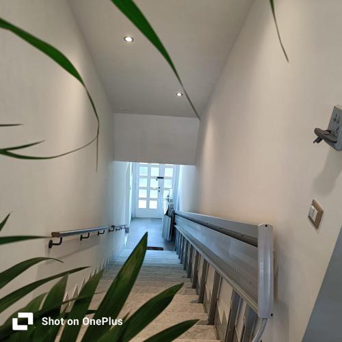 a hallway with a staircase in a building at La Cerasa in Contigliano