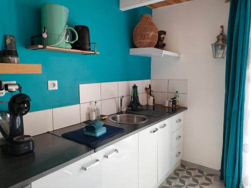Kuchyň nebo kuchyňský kout v ubytování La Suite 27 bis