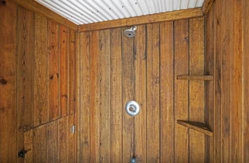 a room with a wooden wall with a ceiling at Oceans 6 condo in Pine Knoll Shores