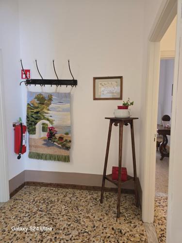 a room with a table and a painting on the wall at Come a casa in Tognazza