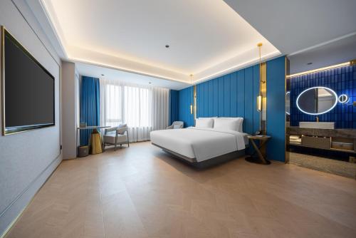 Mido Hotel - Nanning Anji Wanda Plaza Branchにあるベッド