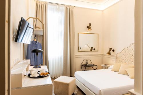 Postel nebo postele na pokoji v ubytování Albergo Chiusarelli