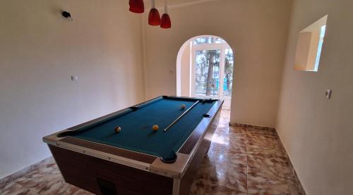 a room with a pool table with balls on it at Gutenberg Villa in Balatonalmádi
