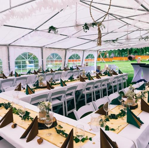 a marquee set up for a wedding with tables and chairs at Pension Tereza & Šumavské Roubenky in Sušice