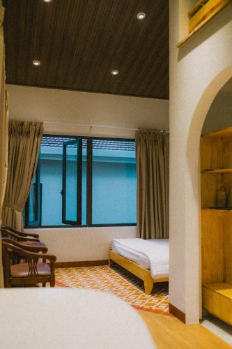 Кровать или кровати в номере Gỗ Bungalow & Homestay