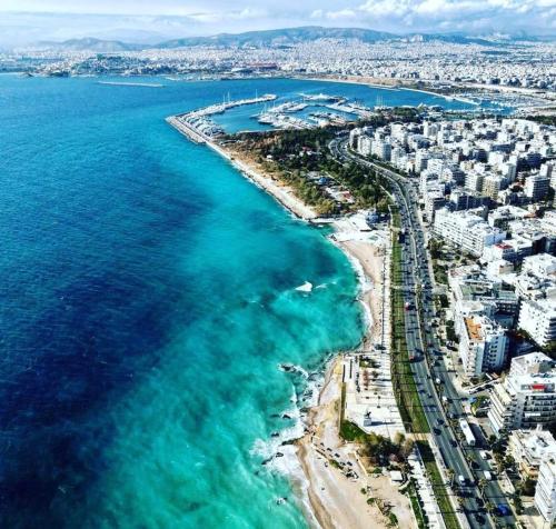 an aerial view of a beach and the ocean at Sunset luxury studio by the sea in Athens