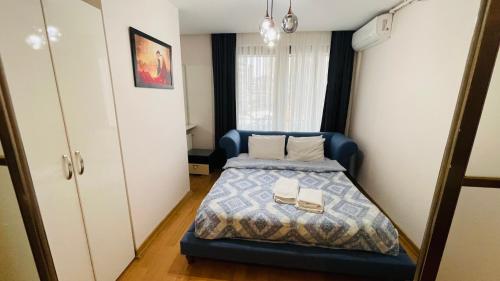 a bedroom with a bed with two books on it at CTS Elysium Residence Taksim in Istanbul