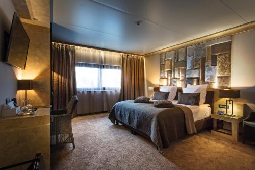 Postel nebo postele na pokoji v ubytování Thermen Londerzeel Hotel