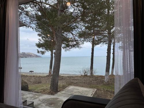 a room with a window looking out at the ocean at Nirvana Lake View in Sevan