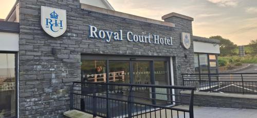 a royal court building with a sign on it at Royal Court Hotel in Portrush