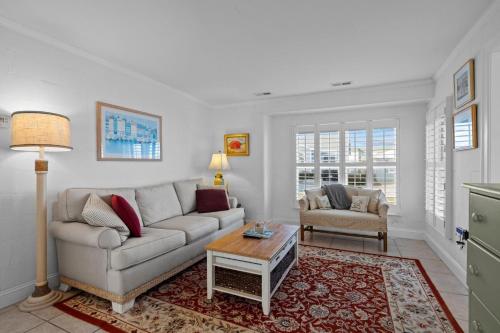 a living room with a couch and a table at Salt Life home in Atlantic Beach