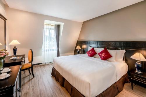 Postel nebo postele na pokoji v ubytování Hotel Sapa Square Affiliated by Melia