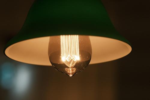 a close up of a green ceiling light at ゲストハウス桜月荘 in Kagoshima