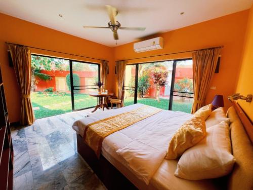 a bedroom with a large bed and a large window at View Talay Villas 3 Bed Rooms Private Pool in Jomtien Beach