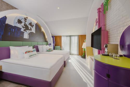 En eller flere senge i et værelse på The Land Of Legends Nickelodeon Hotel Antalya