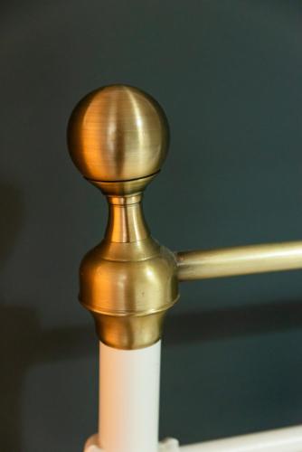 a close up of a brass knob on a ceiling fan at Nina's Apartments in Kómi