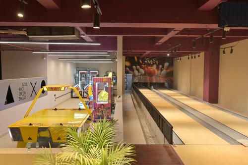 an empty bowling alley with a bowling machine in the middle at Clarks Safari Haridwar in Haridwār