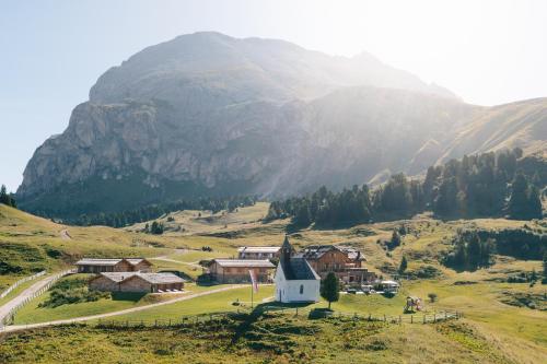 a small church in the middle of a mountain at Zallinger Dolomites in Seiser Alm 