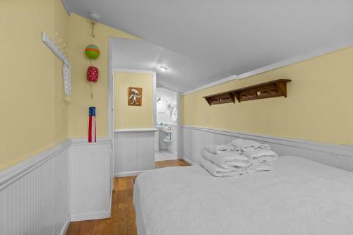 a bedroom with a bed and a bathroom at Mr, Bennie's Cafe home in Harkers Island