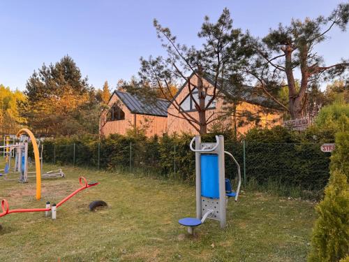 a park with a playground with a play equipment at Forest Mood in Wieck