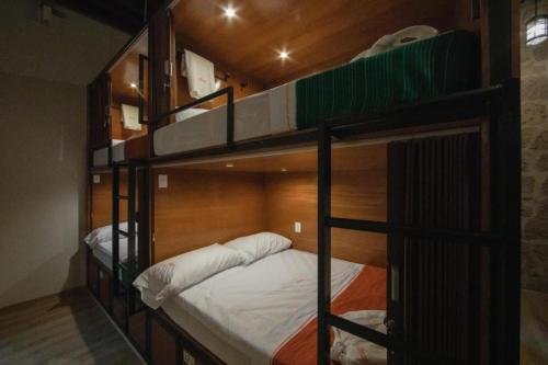 Postel nebo postele na pokoji v ubytování OYO Hostal Mich