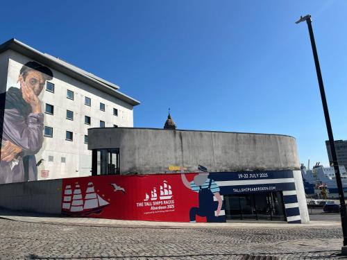 a building with a mural on the side of it at ibis Aberdeen Centre – Quayside in Aberdeen