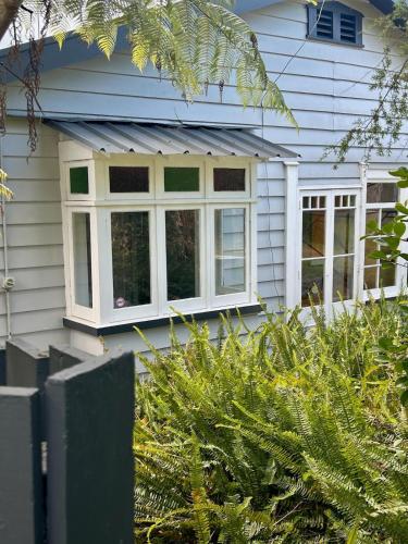 a window on the side of a house at Character Home in Prime Location in Whangarei