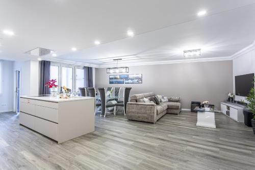 a living room with a couch and a table at Imperatriz Madeira Apartment in Funchal