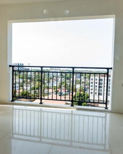a large window with a view of a building at Eastern Hills Apartments in Accra