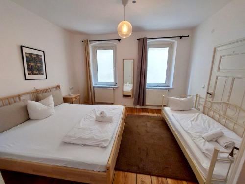 Postel nebo postele na pokoji v ubytování Old Town Center Apartments