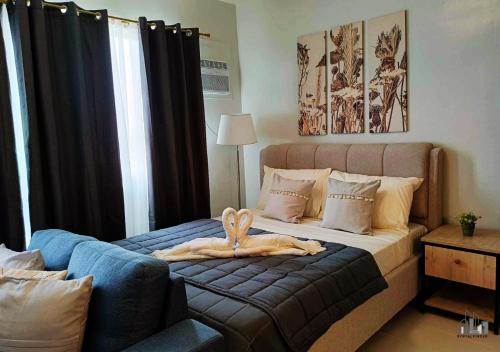 Postel nebo postele na pokoji v ubytování Family-Friendly Condo with Free Parking, Pool and Gym in Palawan - B2 7Beryl