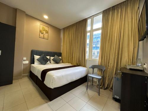 Postel nebo postele na pokoji v ubytování SS Grey Hotel