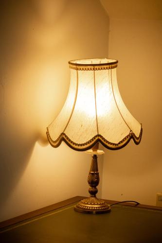 a lamp sitting on top of a table at Albert 1er in Albertville