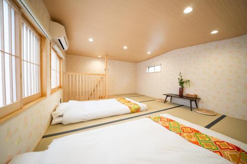 Postel nebo postele na pokoji v ubytování 久宿 東山 Hisaya Higashiyama Room D