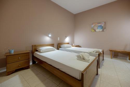 Postel nebo postele na pokoji v ubytování Anthi Studios & Apartments
