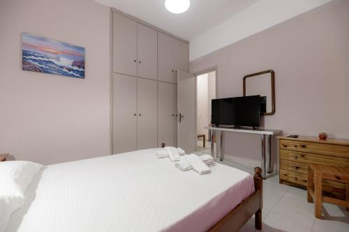 Postel nebo postele na pokoji v ubytování Anthi Studios & Apartments