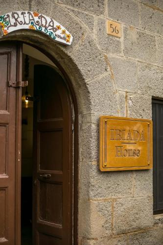 a sign that reads literaria house on the side of a building at iriada house in Rhodes Town