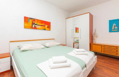 Postel nebo postele na pokoji v ubytování Apartments Amulic