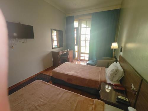 Ένα ή περισσότερα κρεβάτια σε δωμάτιο στο Motel King Mariout