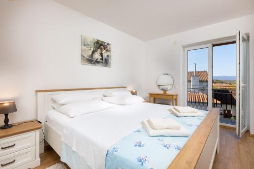 Postel nebo postele na pokoji v ubytování Apartments Barjaktarić