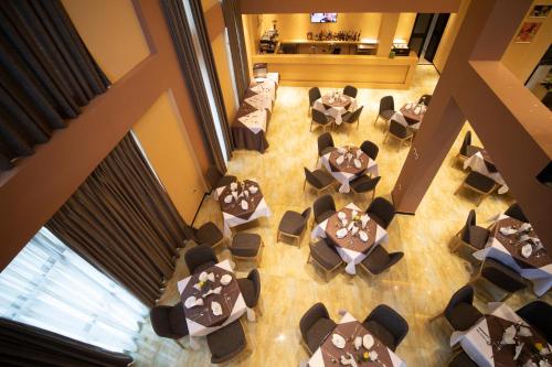 an overhead view of a restaurant with tables and chairs at Vamos Addis Hotel in Addis Ababa