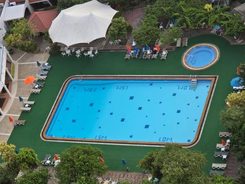 an overhead view of a swimming pool at a resort at PATONG TOWER APARTMENT's 2026 in Patong Beach