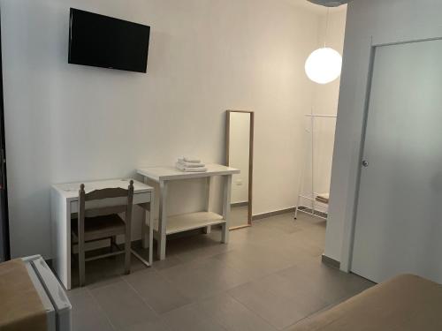 Televízia a/alebo spoločenská miestnosť v ubytovaní B&B BELLAMI'