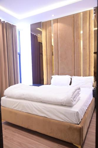 Un ou plusieurs lits dans un hébergement de l'établissement Hotel Taj Palace