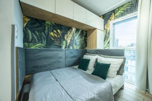 Postel nebo postele na pokoji v ubytování WiguryTower Apartaments 62'