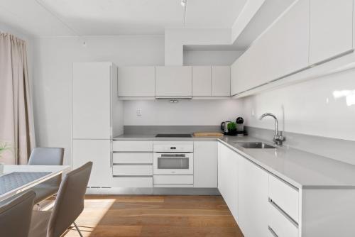 Dapur atau dapur kecil di Wright Apartments - Sørenga