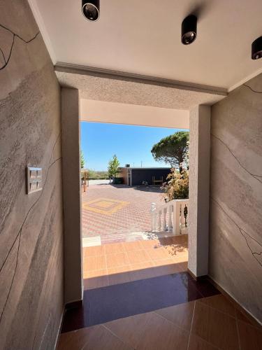 a view from the hallway of a house with the door open at Kamberi Hotel & Apartments in Velipojë