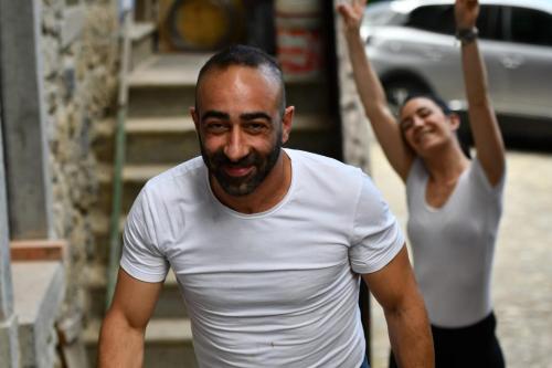 a man in a white shirt and a woman at Agriturismo Grabbia in Grumo