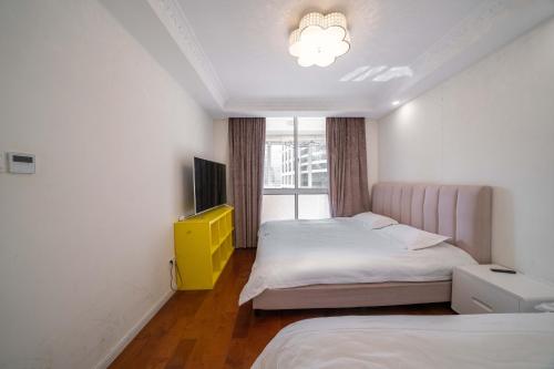 Ένα ή περισσότερα κρεβάτια σε δωμάτιο στο Shanghai Yidu Homestay-160m from People's Square subway station and close to the Bund