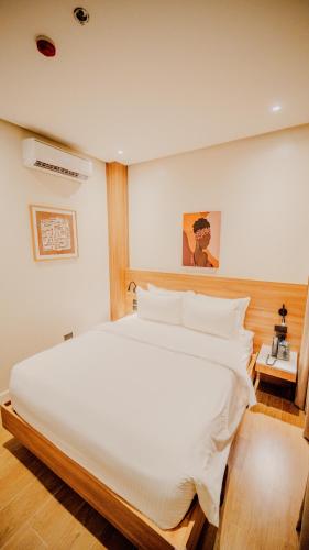 Ένα ή περισσότερα κρεβάτια σε δωμάτιο στο Grand Palm Villas & Hotel